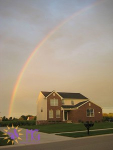 house with a rainbow over it