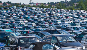 lots of cars in crowded city parking lot